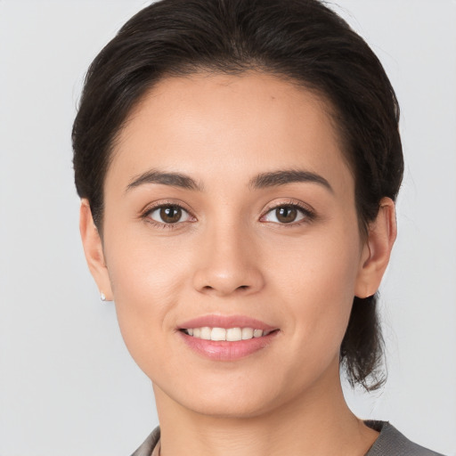 Joyful white young-adult female with medium  brown hair and brown eyes