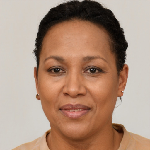 Joyful latino adult female with short  brown hair and brown eyes