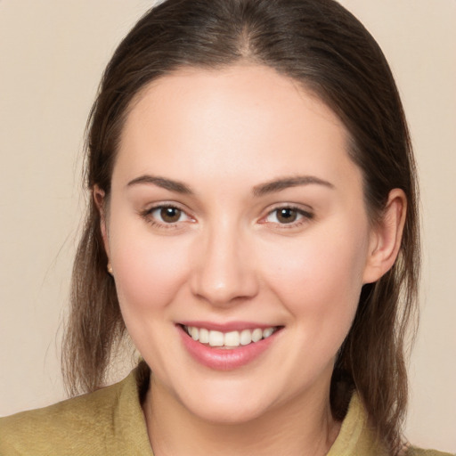 Joyful white young-adult female with medium  brown hair and brown eyes