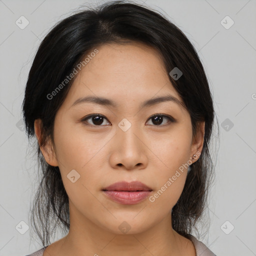 Joyful asian young-adult female with medium  black hair and brown eyes