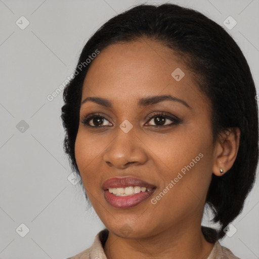 Joyful black young-adult female with medium  black hair and brown eyes