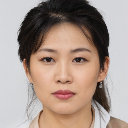 Neutral asian young-adult female with medium  brown hair and brown eyes