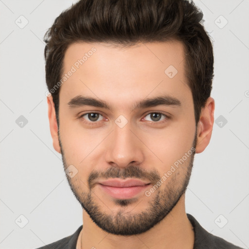 Joyful white young-adult male with short  brown hair and brown eyes