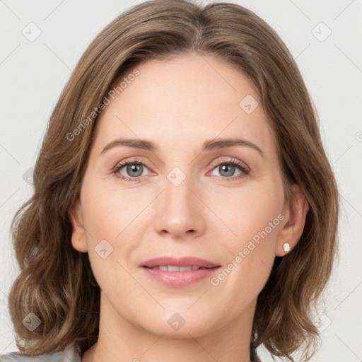 Joyful white young-adult female with medium  brown hair and green eyes