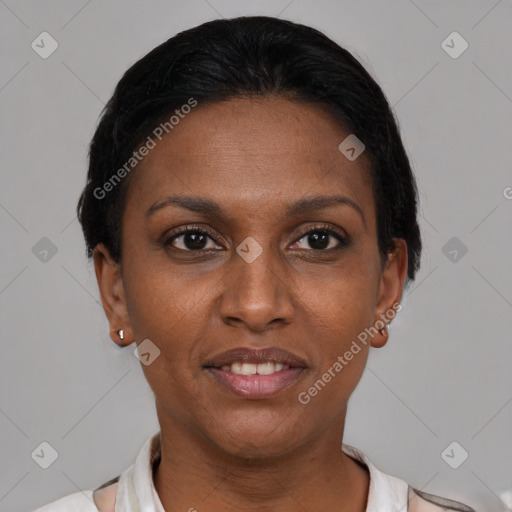 Joyful black adult female with short  brown hair and brown eyes