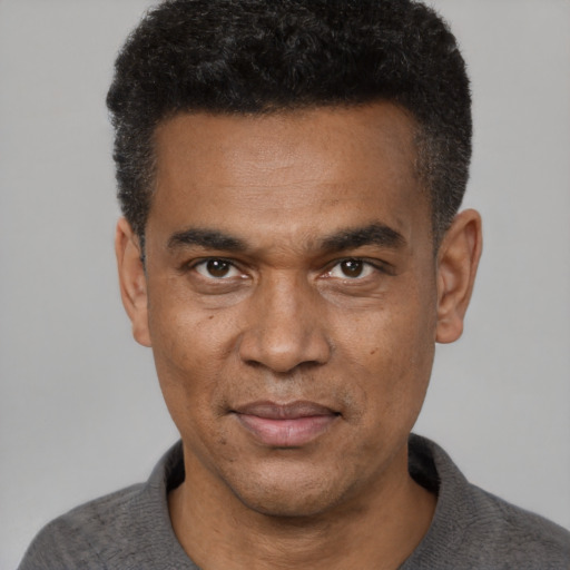 Neutral black adult male with short  black hair and brown eyes
