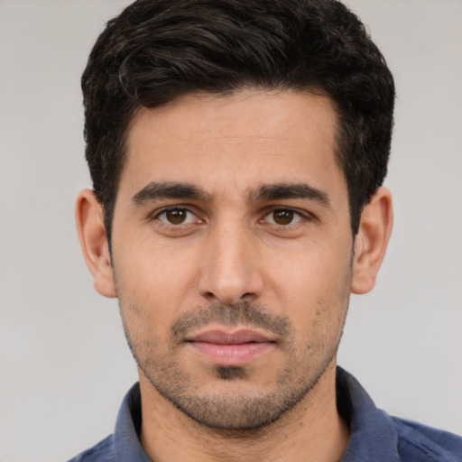 Neutral white young-adult male with short  black hair and brown eyes