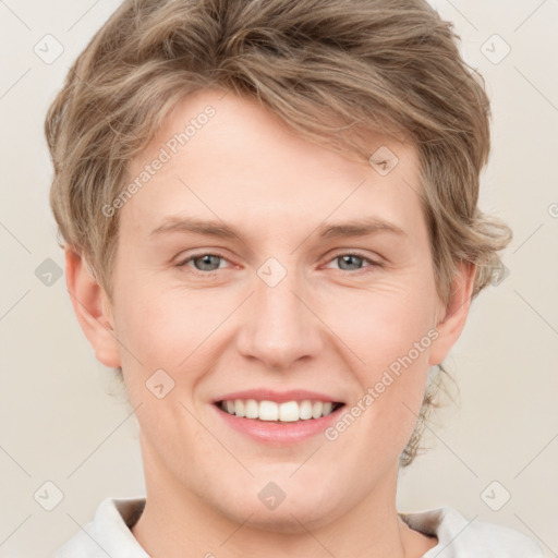 Joyful white young-adult female with short  brown hair and grey eyes