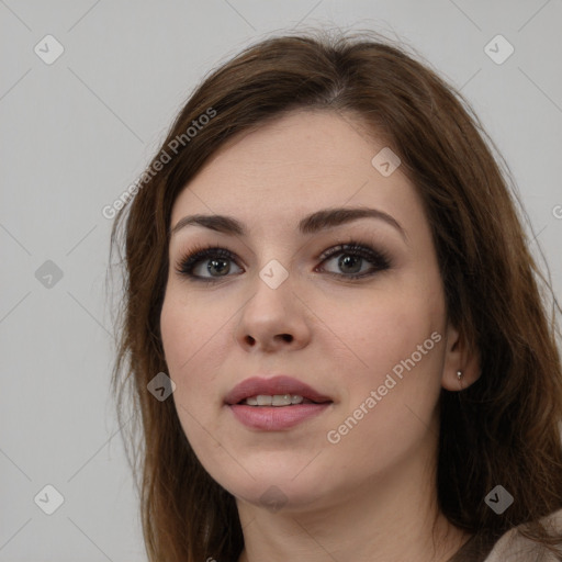 Neutral white young-adult female with long  brown hair and brown eyes