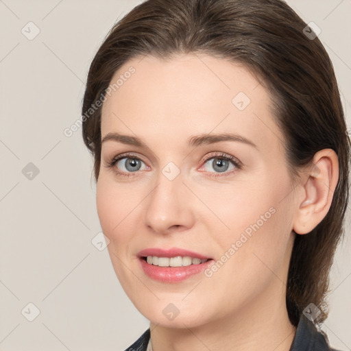 Joyful white young-adult female with medium  brown hair and grey eyes