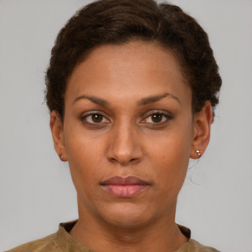 Neutral white young-adult female with short  brown hair and brown eyes