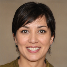 Joyful white adult female with medium  brown hair and brown eyes