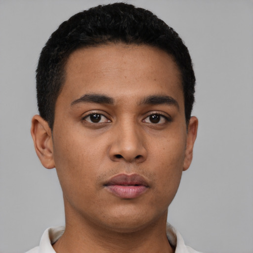 Neutral latino young-adult male with short  black hair and brown eyes