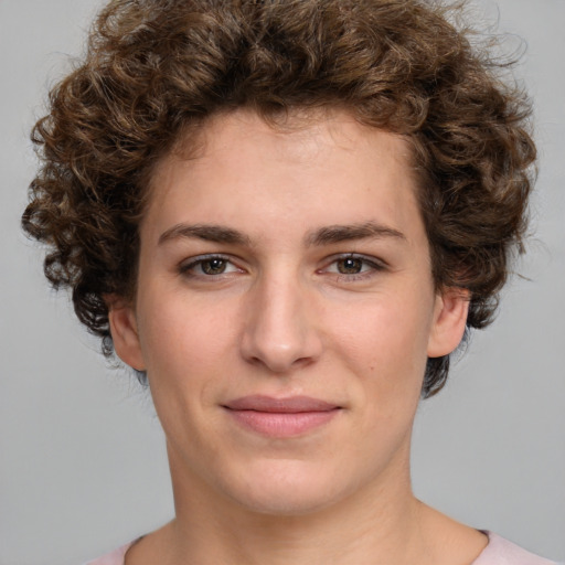 Joyful white young-adult female with medium  brown hair and green eyes