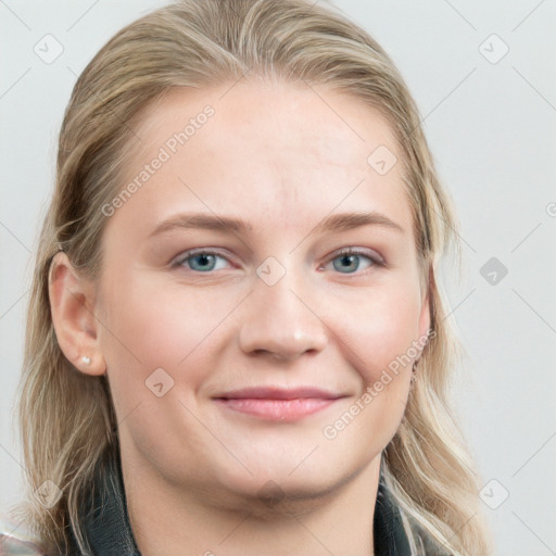 Joyful white young-adult female with long  brown hair and blue eyes