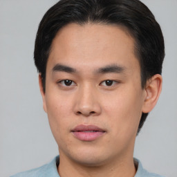 Neutral asian young-adult male with short  brown hair and brown eyes