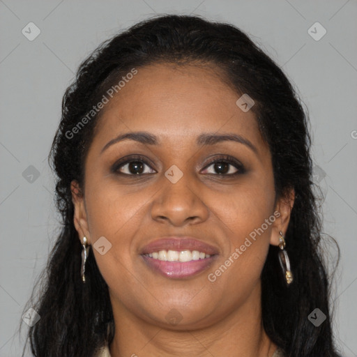 Joyful black young-adult female with long  brown hair and brown eyes