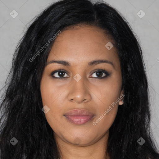 Joyful black young-adult female with long  black hair and brown eyes