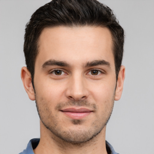 Joyful white young-adult male with short  brown hair and brown eyes