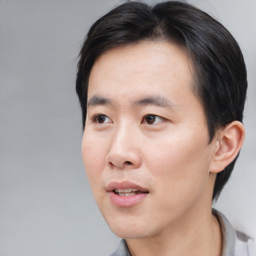 Neutral asian young-adult male with short  black hair and brown eyes