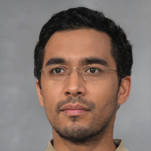 Neutral latino young-adult male with short  black hair and brown eyes