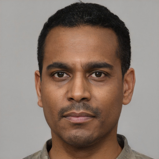 Neutral black young-adult male with short  black hair and brown eyes
