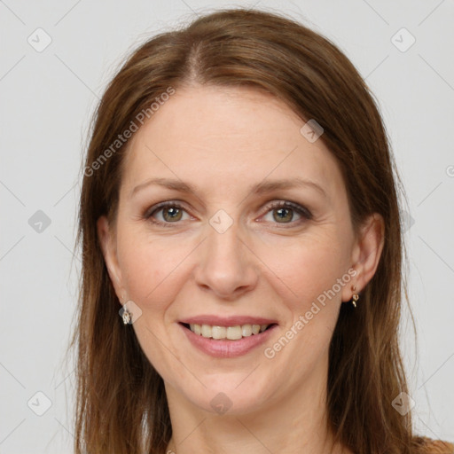 Joyful white adult female with long  brown hair and grey eyes