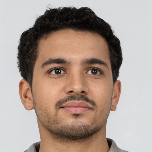 Neutral latino young-adult male with short  brown hair and brown eyes