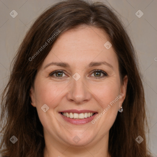 Joyful white adult female with long  brown hair and brown eyes