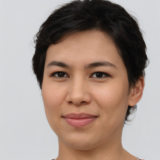 Joyful asian young-adult female with short  brown hair and brown eyes