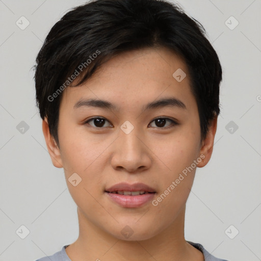 Joyful asian young-adult female with short  black hair and brown eyes