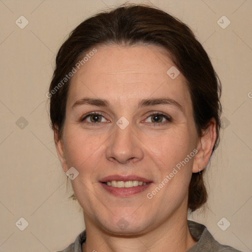 Joyful white adult female with medium  brown hair and brown eyes