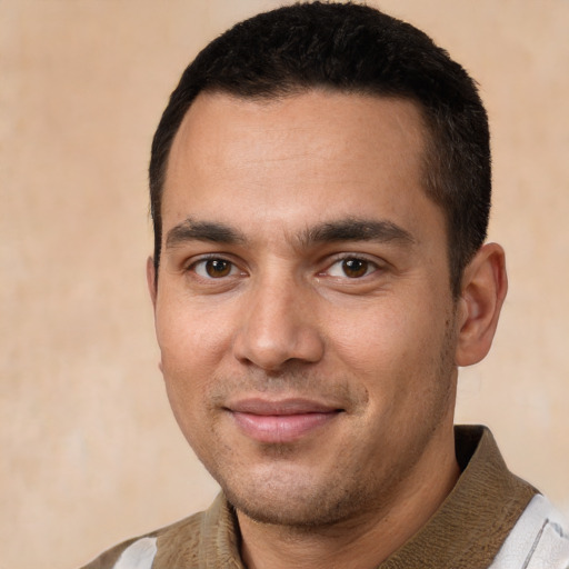 Joyful white young-adult male with short  brown hair and brown eyes