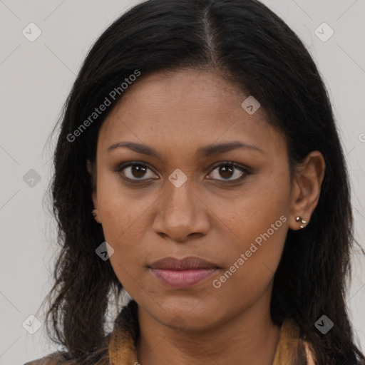 Joyful black young-adult female with long  brown hair and brown eyes