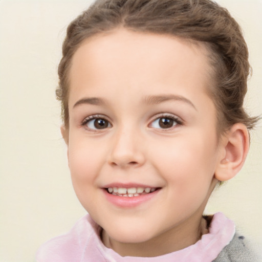 Joyful white child female with short  brown hair and brown eyes