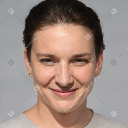 Joyful white adult female with short  brown hair and brown eyes