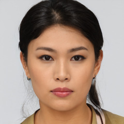 Neutral asian young-adult female with medium  black hair and brown eyes