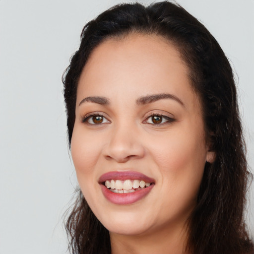 Joyful white young-adult female with long  black hair and brown eyes