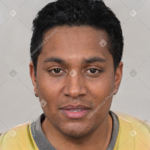 Joyful black young-adult male with short  black hair and brown eyes