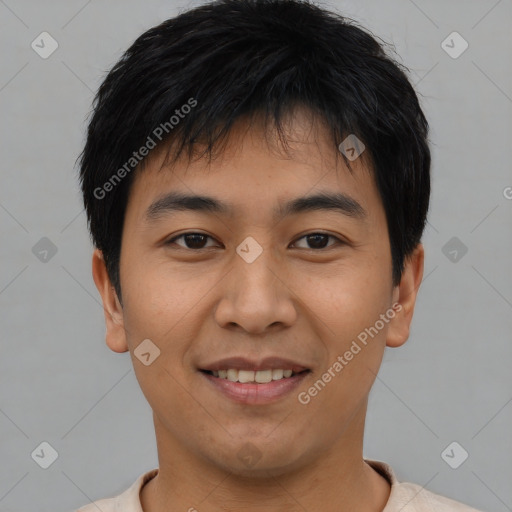 Joyful asian young-adult male with short  black hair and brown eyes