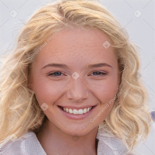 Joyful white young-adult female with long  brown hair and blue eyes