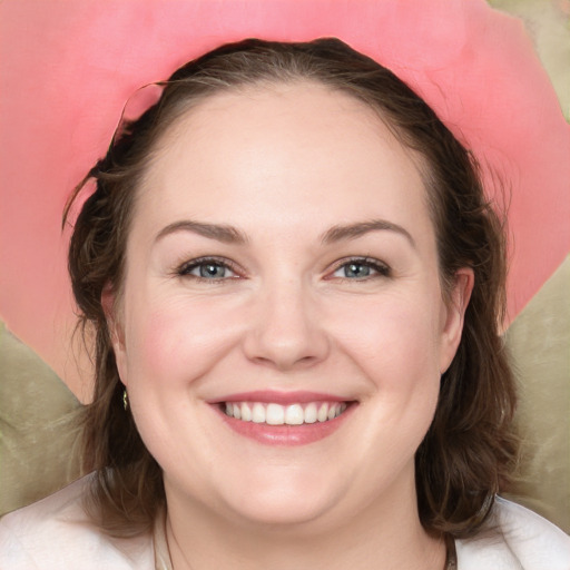 Joyful white young-adult female with medium  brown hair and blue eyes