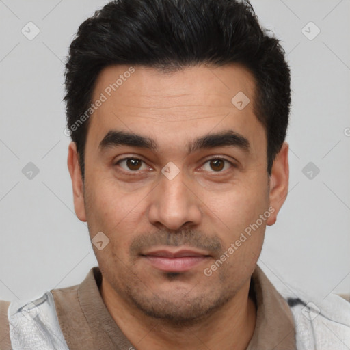 Joyful latino young-adult male with short  black hair and brown eyes
