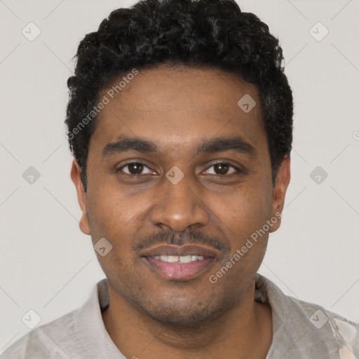Joyful black young-adult male with short  black hair and brown eyes