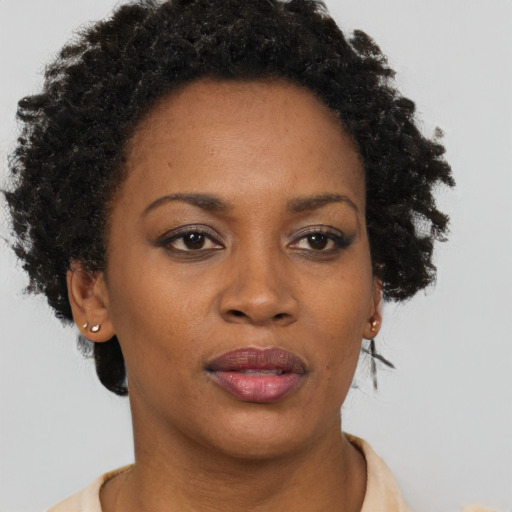 Neutral black adult female with short  brown hair and brown eyes