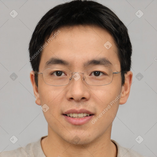 Joyful asian young-adult male with short  black hair and brown eyes