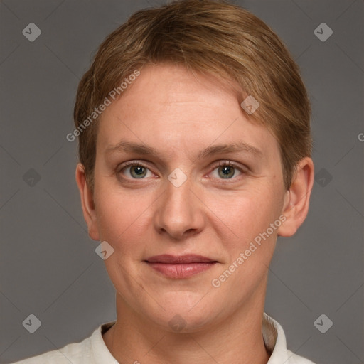 Joyful white adult female with short  brown hair and grey eyes