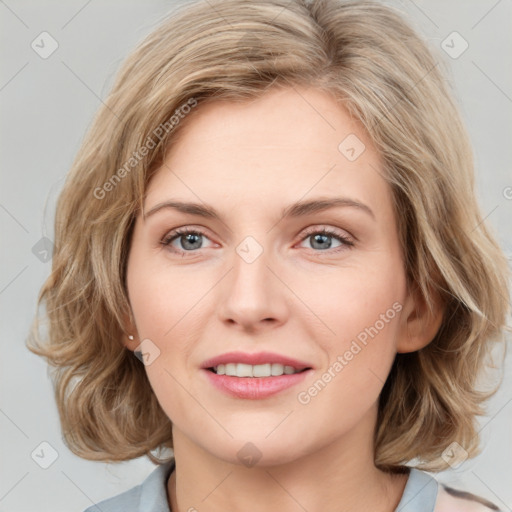 Joyful white young-adult female with medium  brown hair and blue eyes