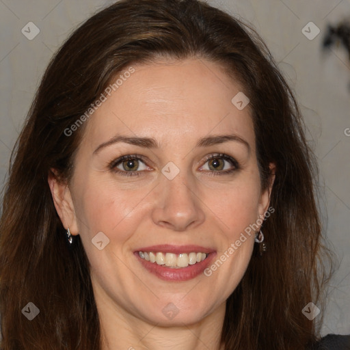 Joyful white adult female with long  brown hair and brown eyes