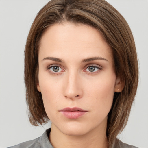 Neutral white young-adult female with medium  brown hair and grey eyes